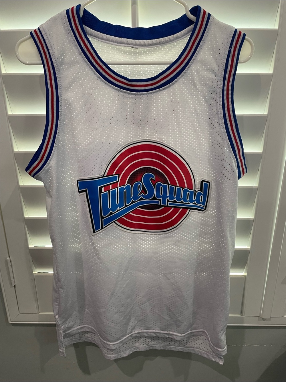 Tune Squad White Basketball Jersey with Red & Blue Logo